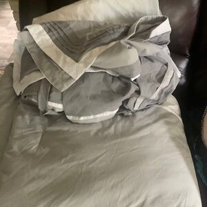 King size comforter with two pillowcases and a sham